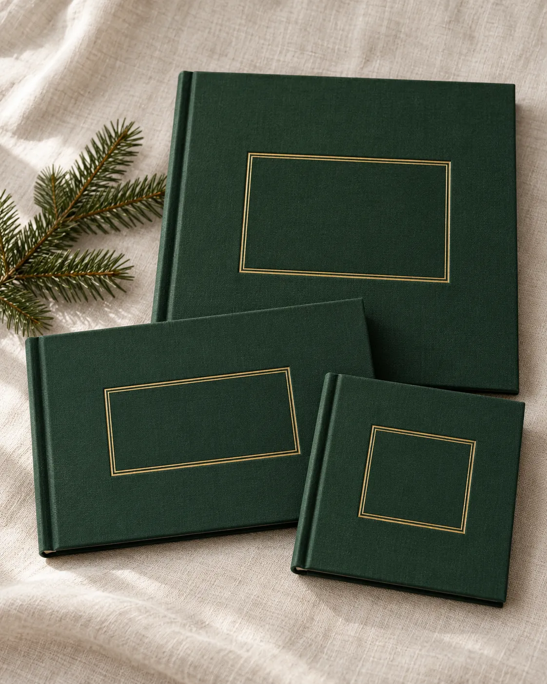Three green hardback picture books in square, landscape and large square sizes on linen